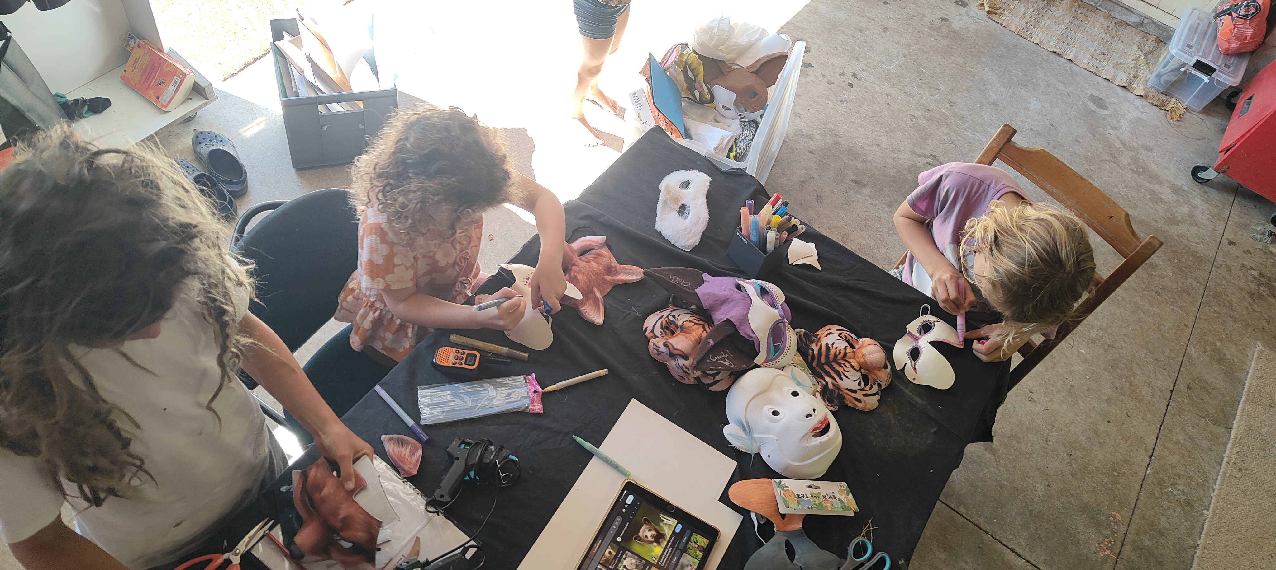 Children painting animal masks at The Bush Base